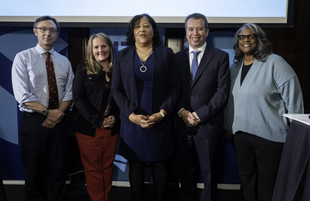 Group shot of presenters at the City Club of Chicago. Left to right: Dr. Jens Ludwig, Laura Thonn from PricewaterhouseCoopers LLP, and CPS CEO Pedro Martinez, Lorraine Forte of the Chicago Sun-Times.